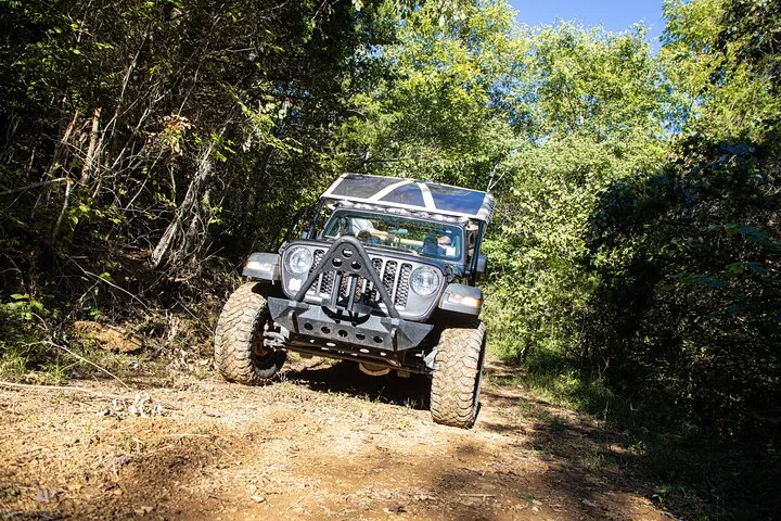 Tour jeep on a dirt track in the Smoky Mountains foothills